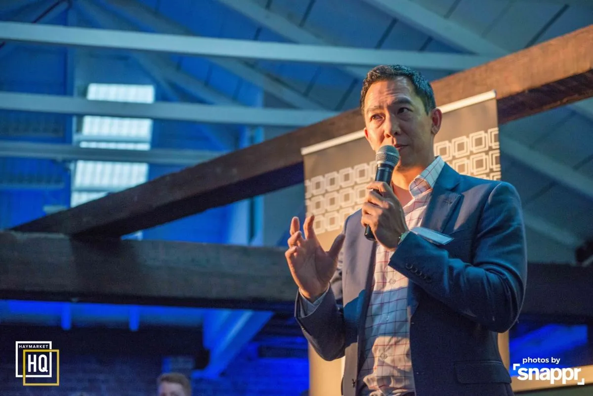 A speaker with a microphone at HHQ