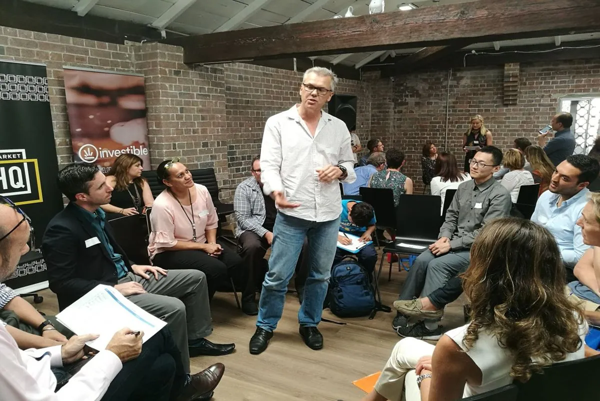 Founders in a circle getting feedback at an Investible session