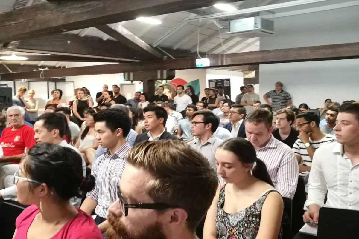 A packed room at an HHQ event