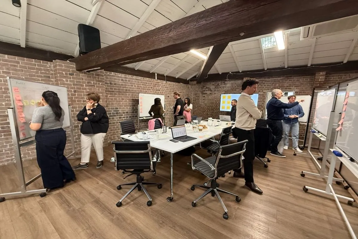 A strategy workshop with whiteboards at HHQ