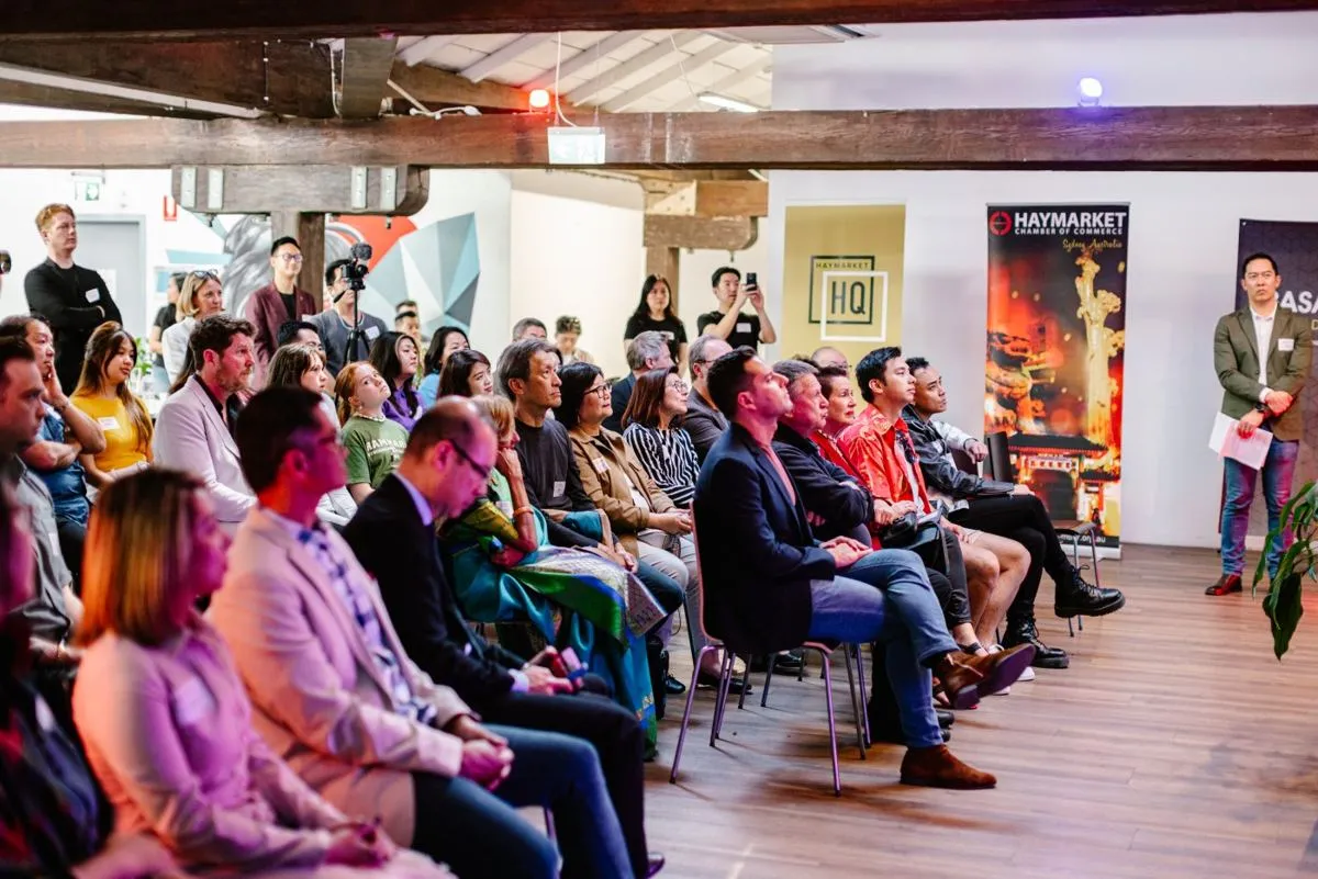 A seated audience at a Haymarket Chamber of Commerce event at HHQ